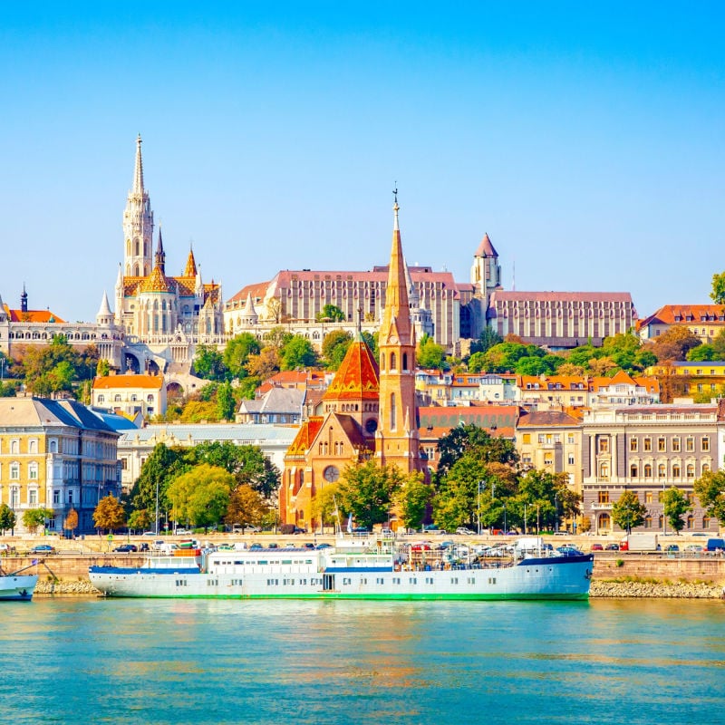 The buildings and boats of Budapest as seen from the waters of the Danube River