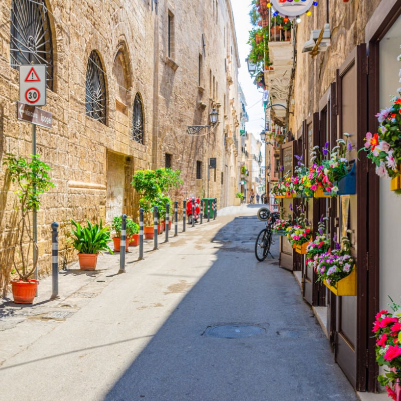 Narrow street in the historic city center of Taranto, Italy