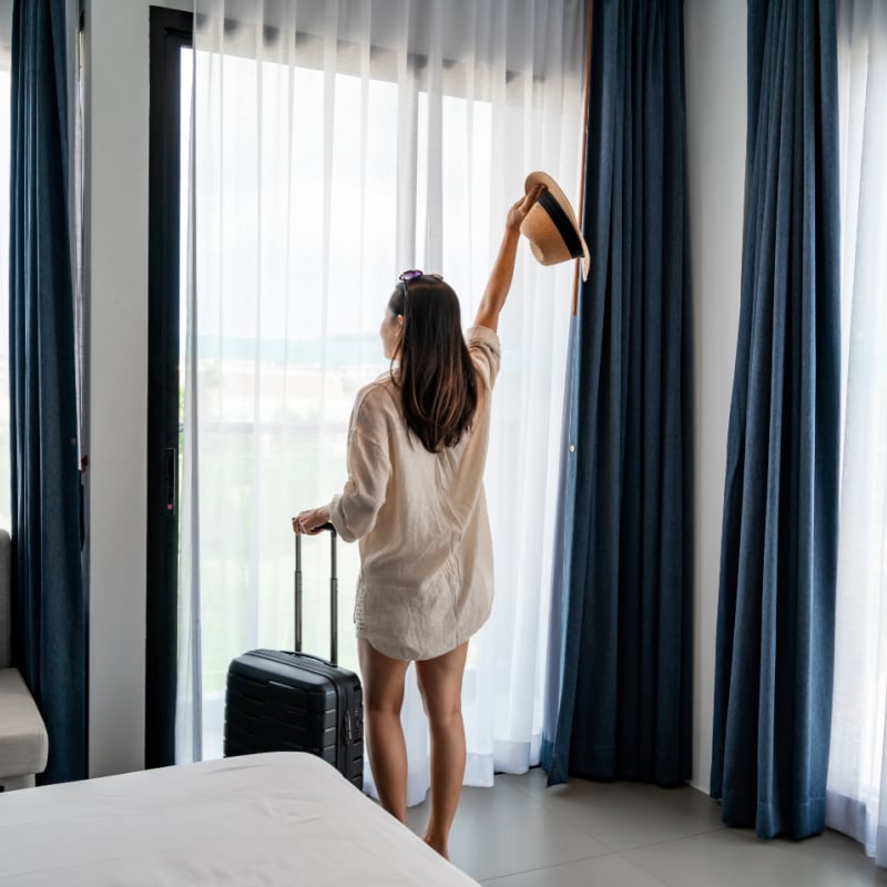 Woman in Hotel Room, Unspecified Location