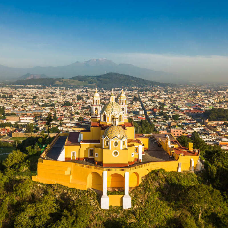 Aerial View Of A Landmark Yellow Church Atop A Hill In Puebla, Central Mexico, Latin America