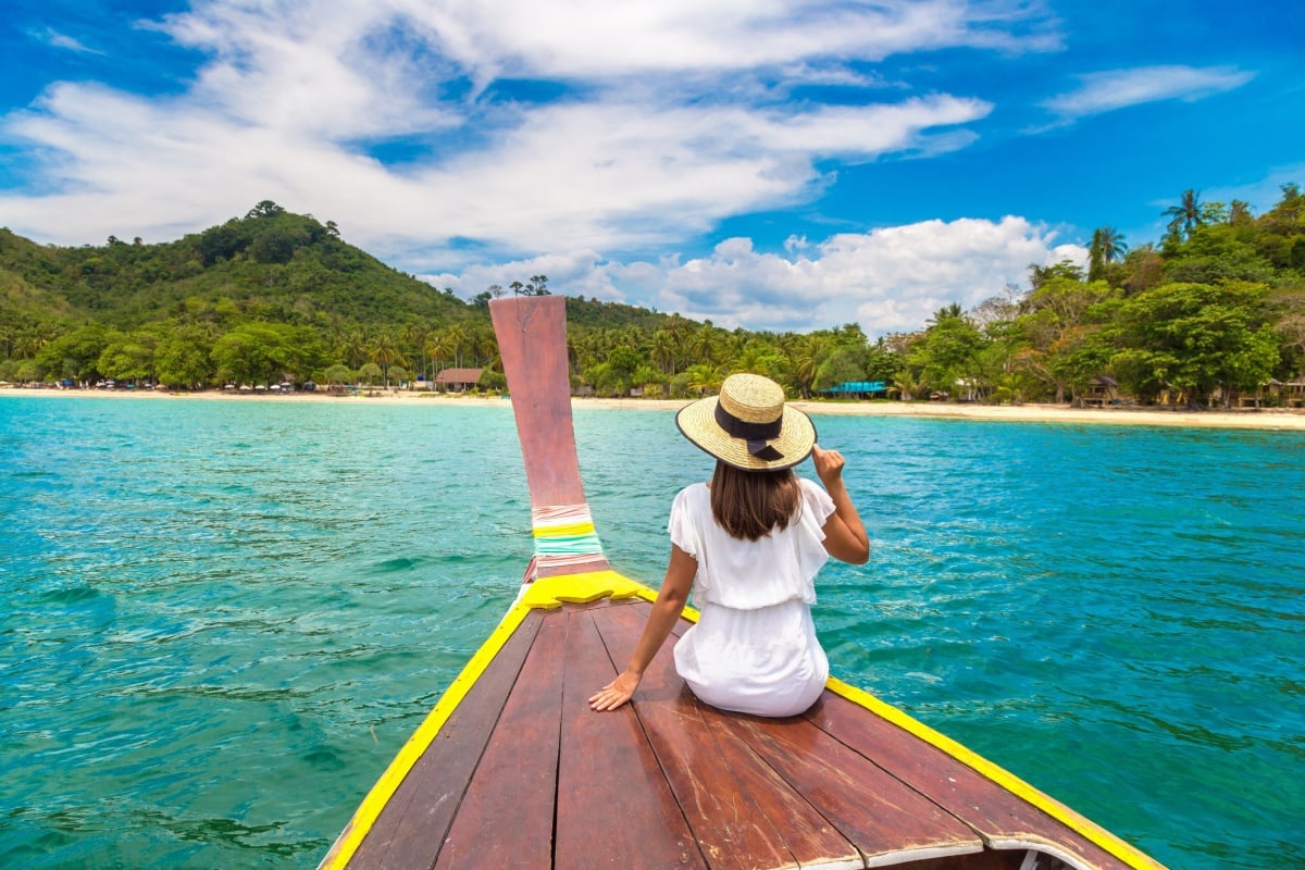 A female traveler taking a boat ride with views of punta cana's beaches