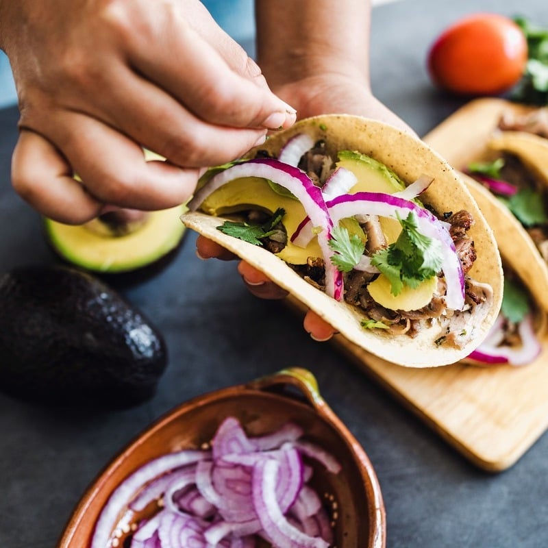 Latin American Woman Preparing A Taco In Mexico, Latin America