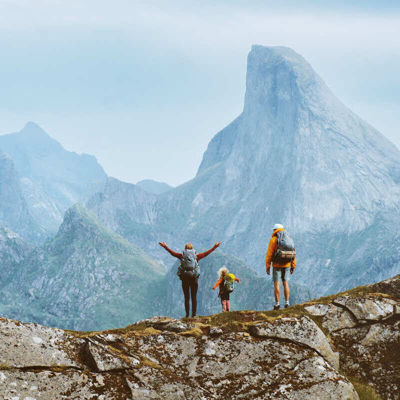 A Family Of Tourists Hiking In Lofoten, Norway, Scandinavia, Northern Europe