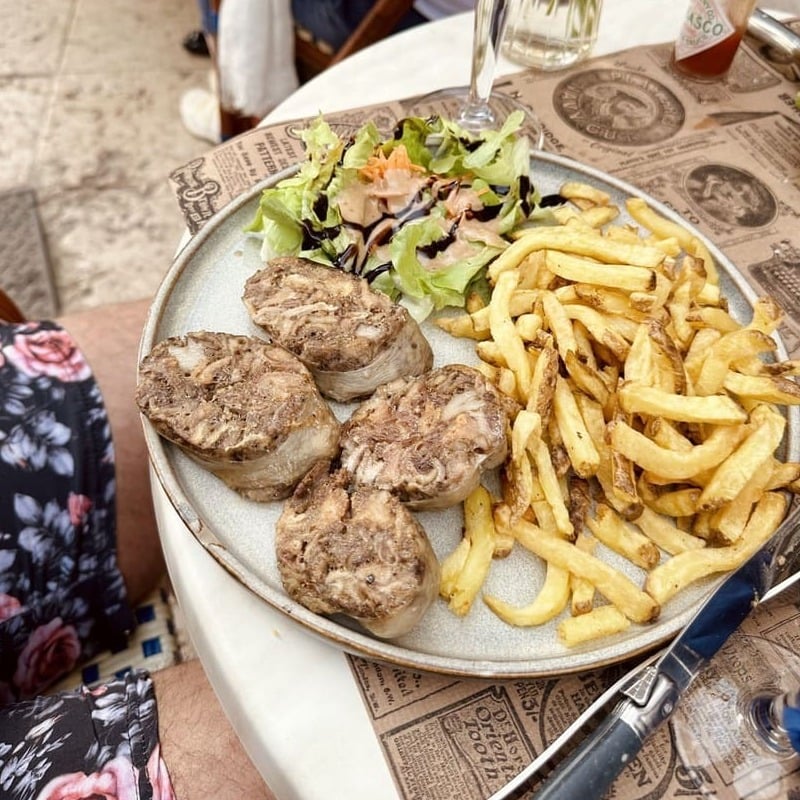 A Plate Of Andouillette, Traditional French Dish Served In France, Europe