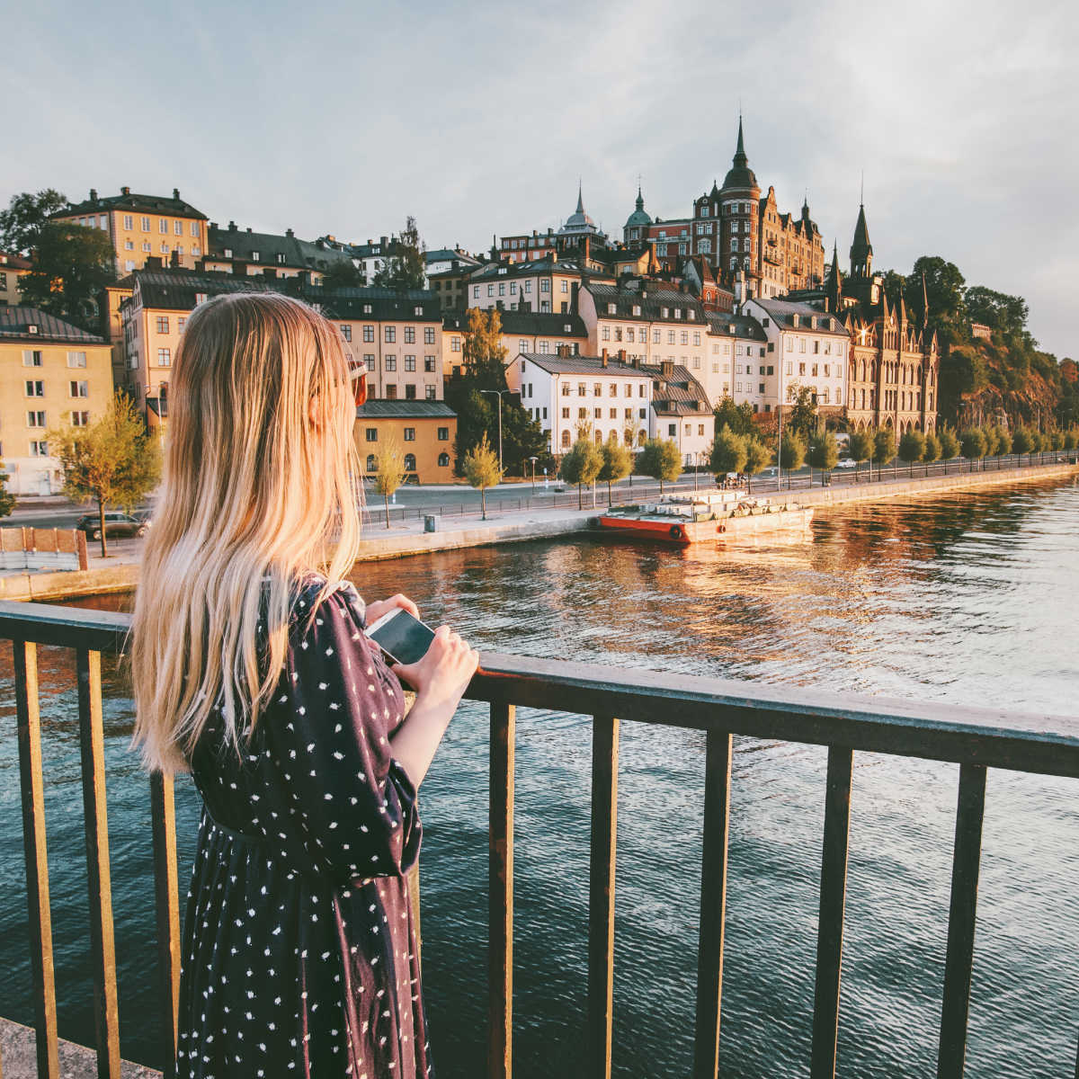 Female solo traveler overlooking Stockholm 