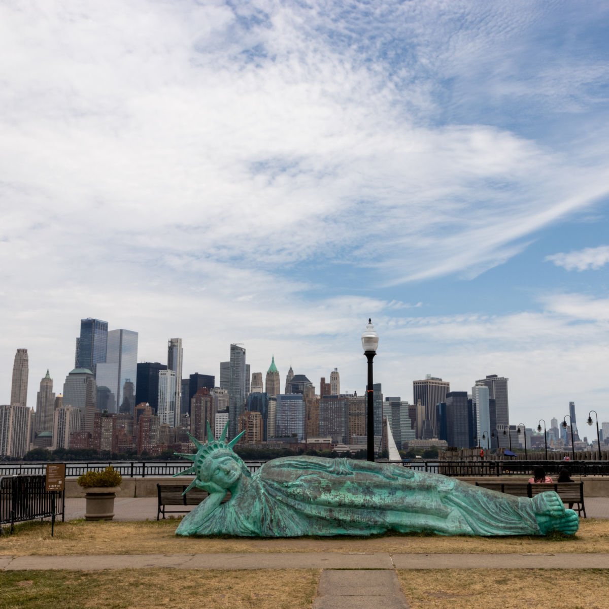 Statue of Liberty art installation backdropped by NYC skyline