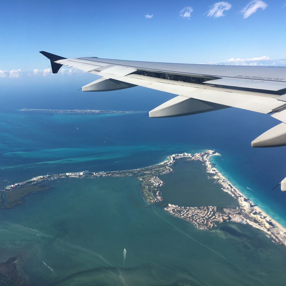 Unmarked plane flying over Cancun