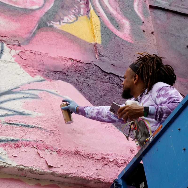 Artist creating mural in Jersey City