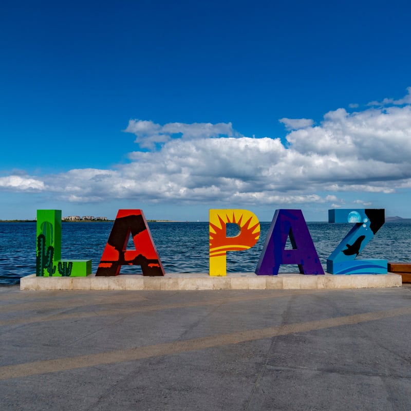 Colorful La Paz sign on coast