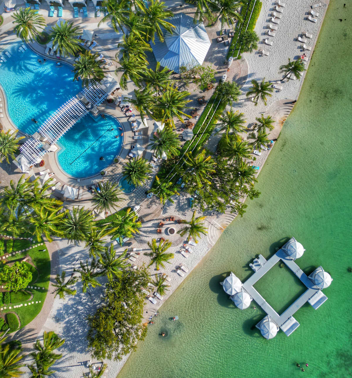 Playa Largo in Key Largo, Drone shot from above showing the pool and over water cabanas