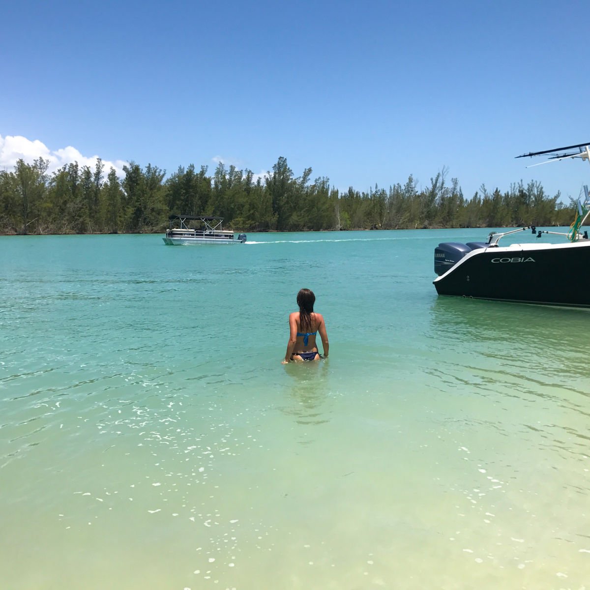 Woman swimming in clear waters of Keewaydin Island