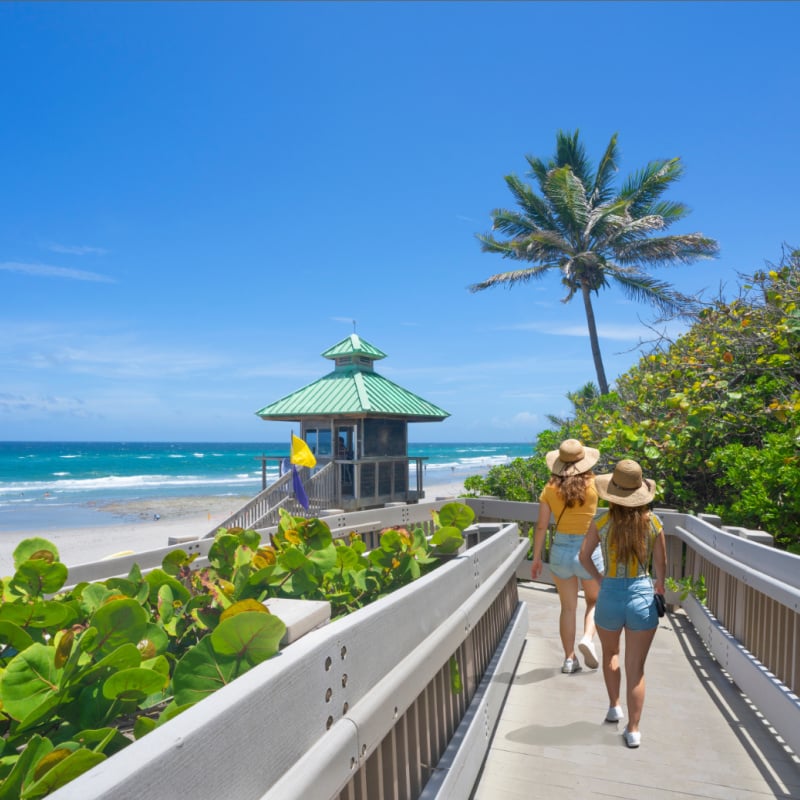 Women walking on boardwalk, Red Reef Park, Boca Raton, Florida USA