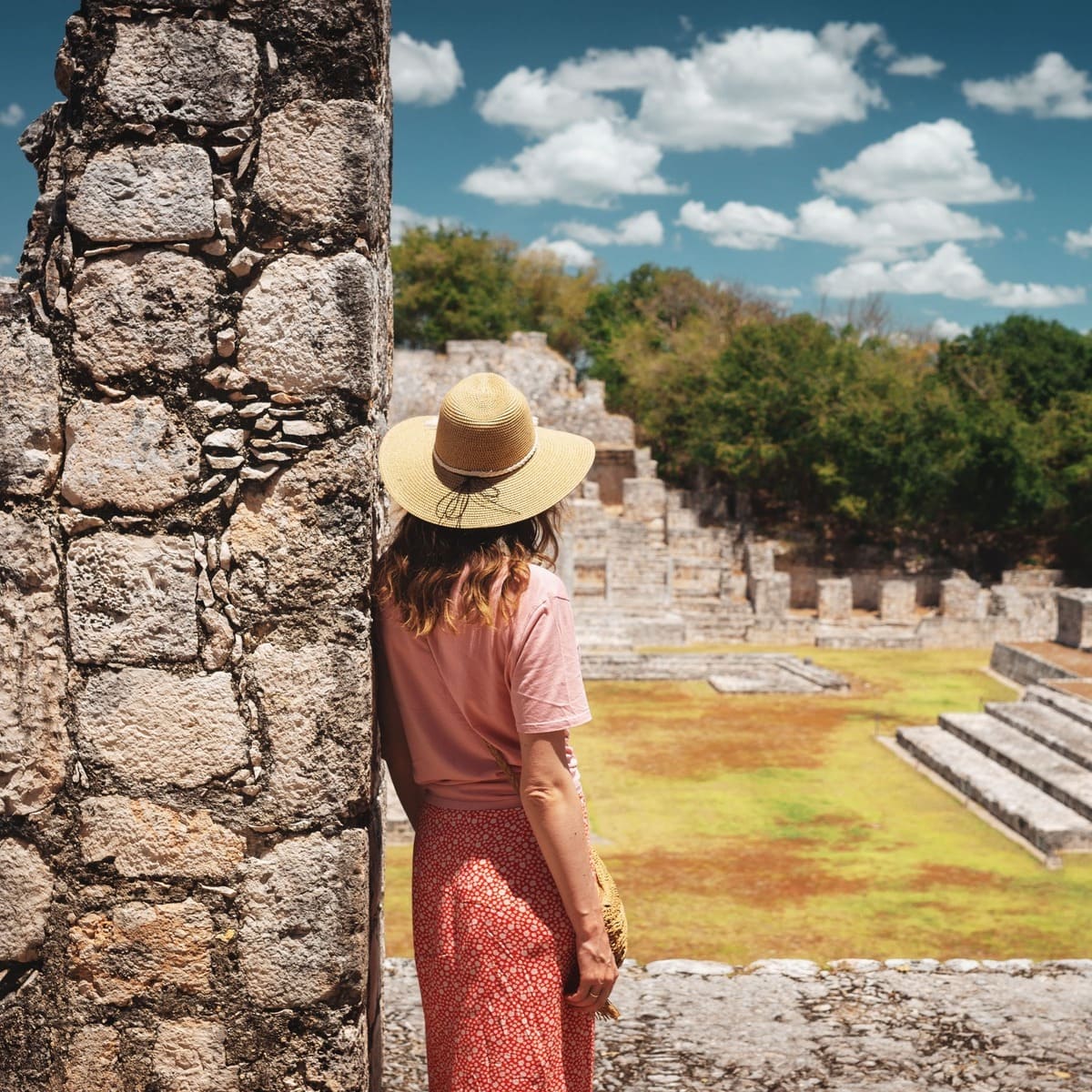 Young Woman Admiring Mayan Ruins In Mexico