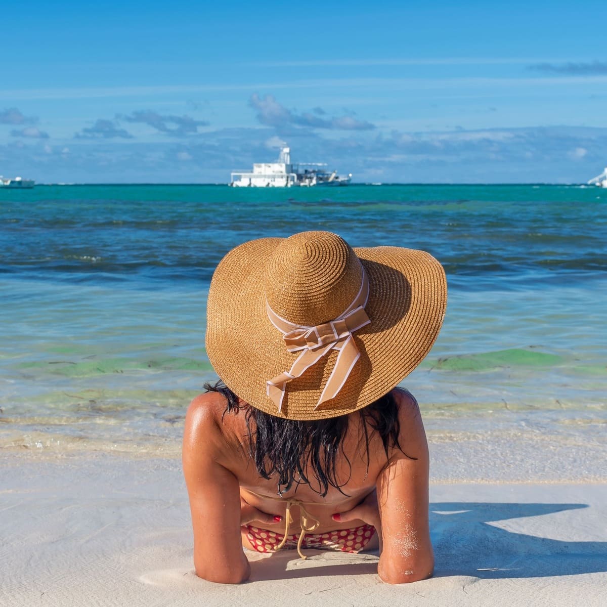 Young Woman Sunbathing On A Beach In Punta Cana, The Dominican Republic