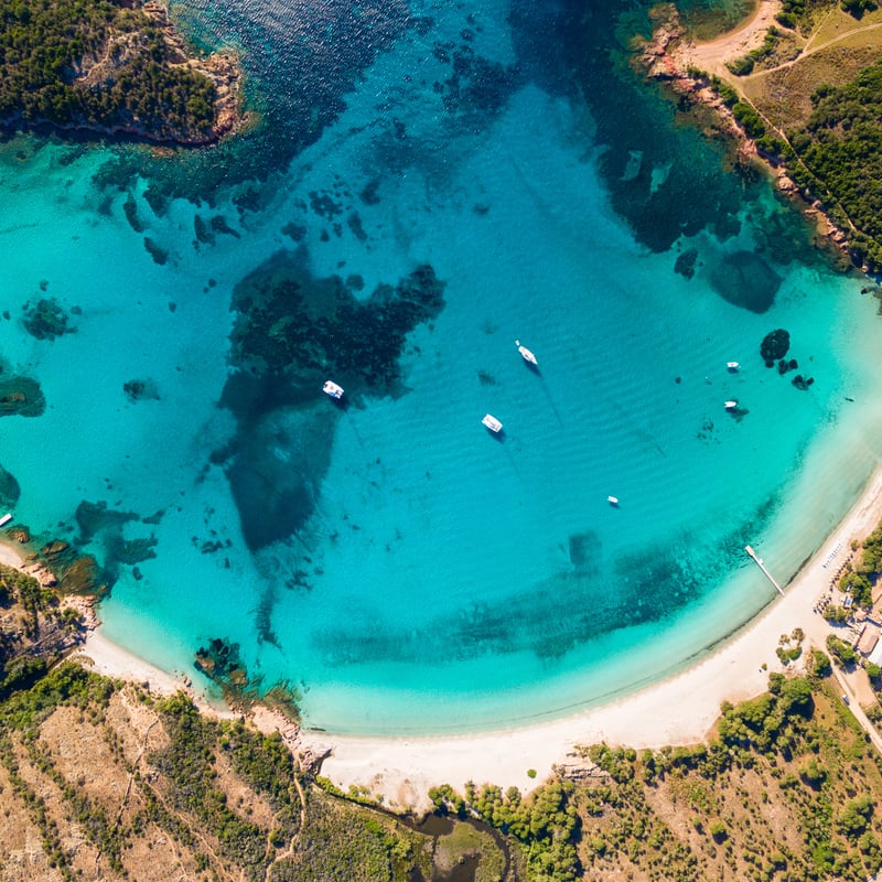 Aerial Panoramic View Of Rondinara Beach, An Idyllic Beach In Corsica, France, Bounded By A Turquoise Colored Mediterranean Sea, Southern Europe