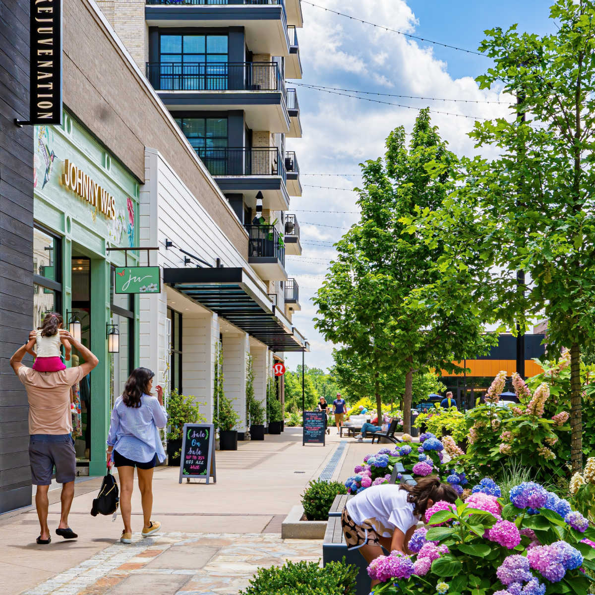 Family walking down vibrant street in Cary, NC