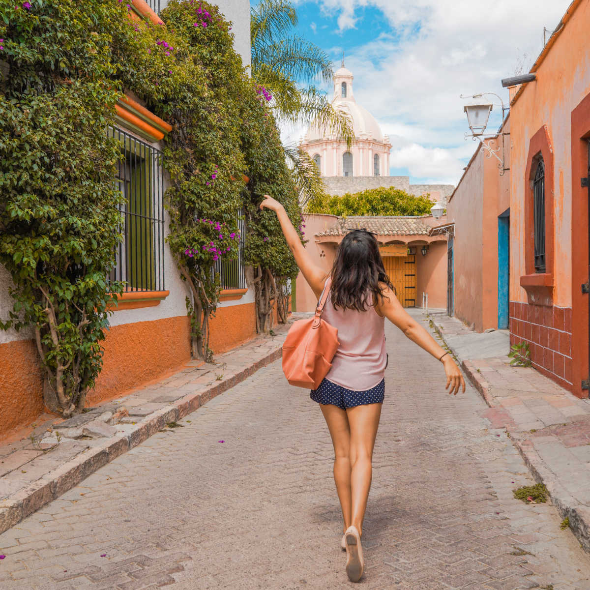 Female walking town street in Mexico small town