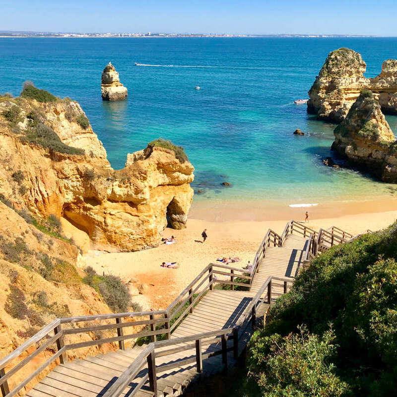 Wooden Staircase Leading Down To A Sandy Atlantic Beach Near Portimao, The Algarve, Southern Portugal, Southern Europe