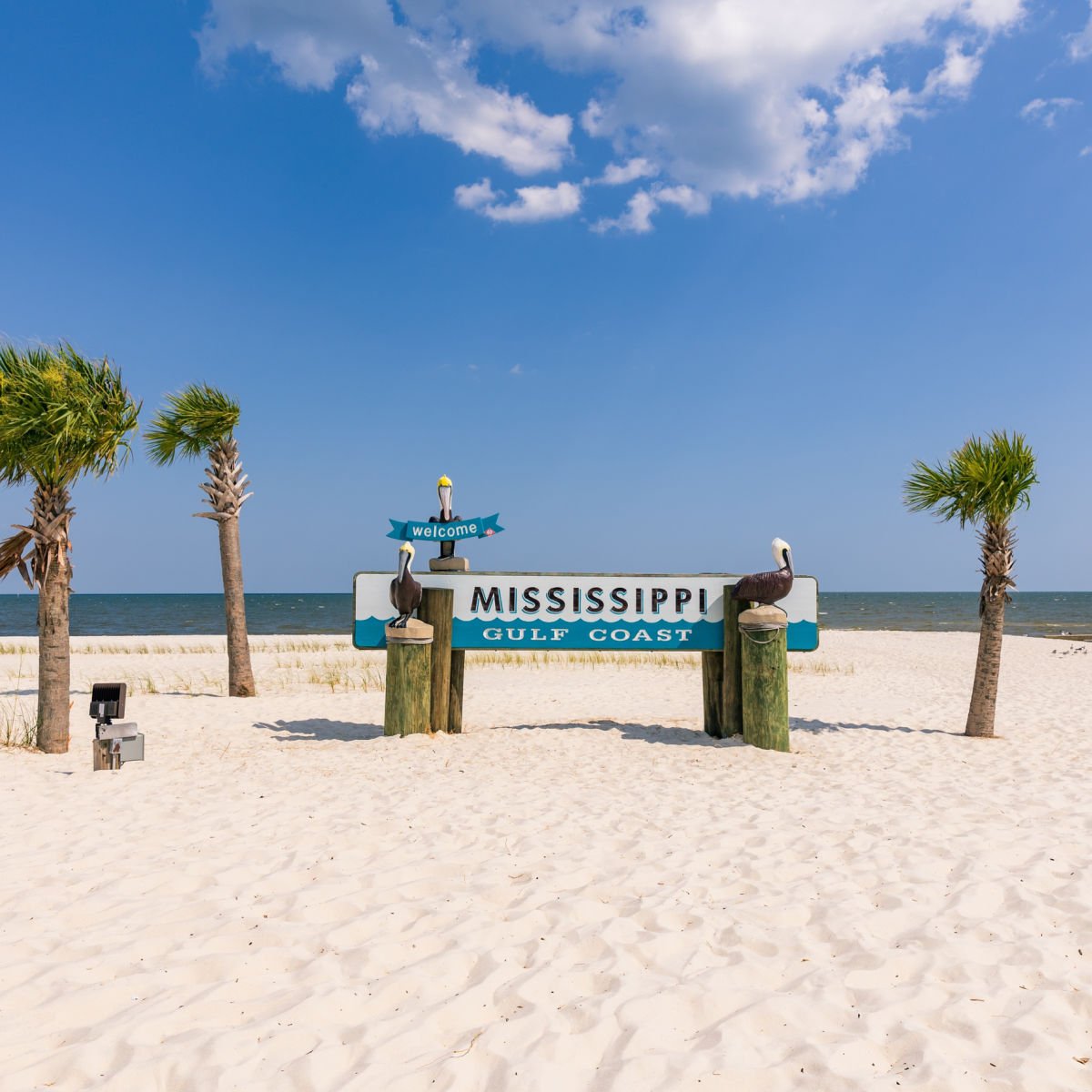 Mississippi Gulf Coast sign on white sand