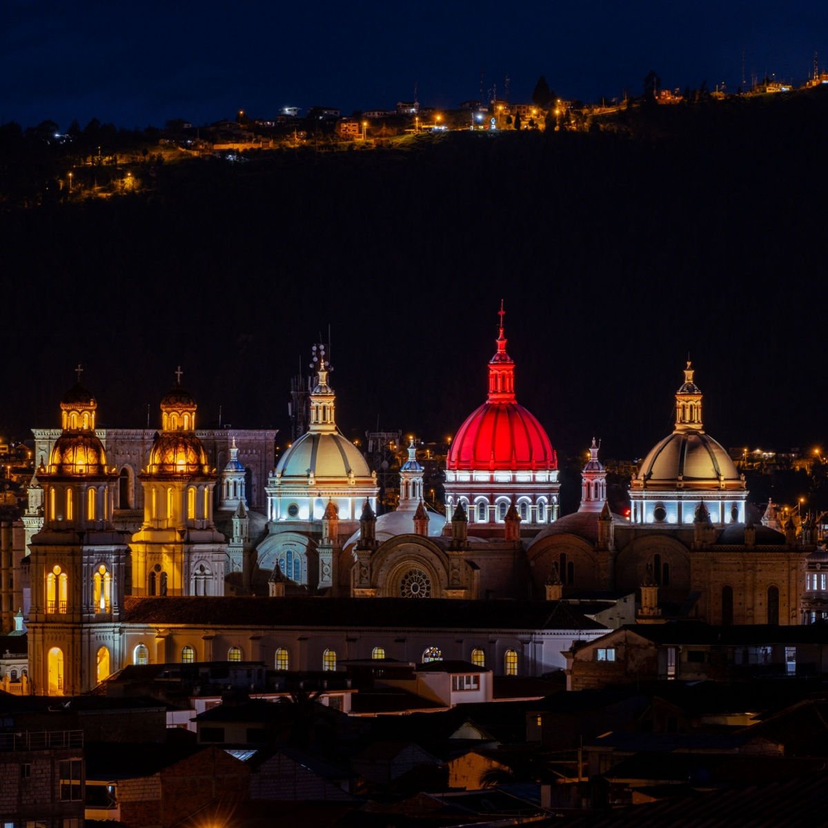 Night view of illuminated Cathedral of Immaculate Conception (Catedral de Immaculada Concepcion) and Santo Domingo Church in Cuenca, Ecuador.