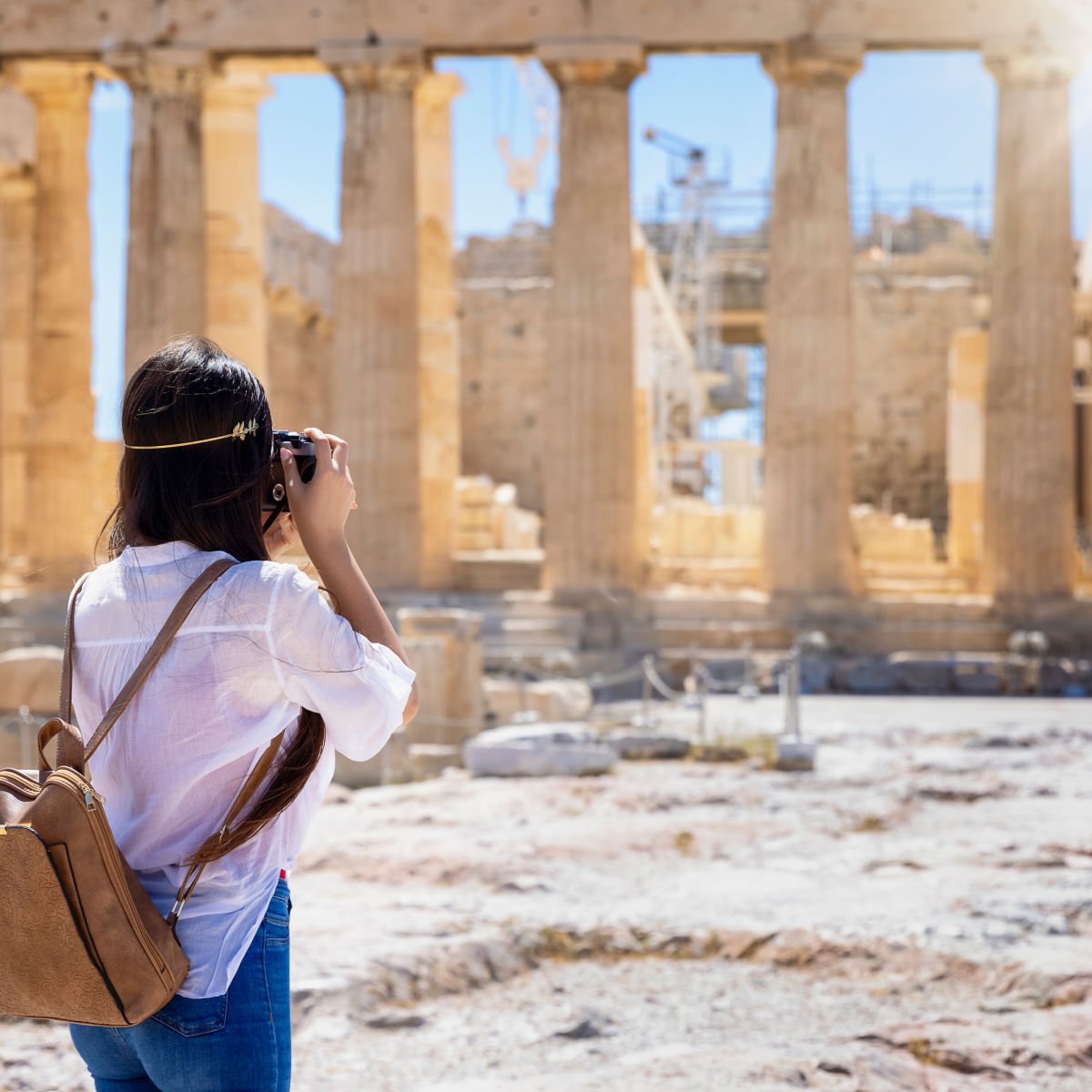 Tourist taking photos of the Parthenon Temple