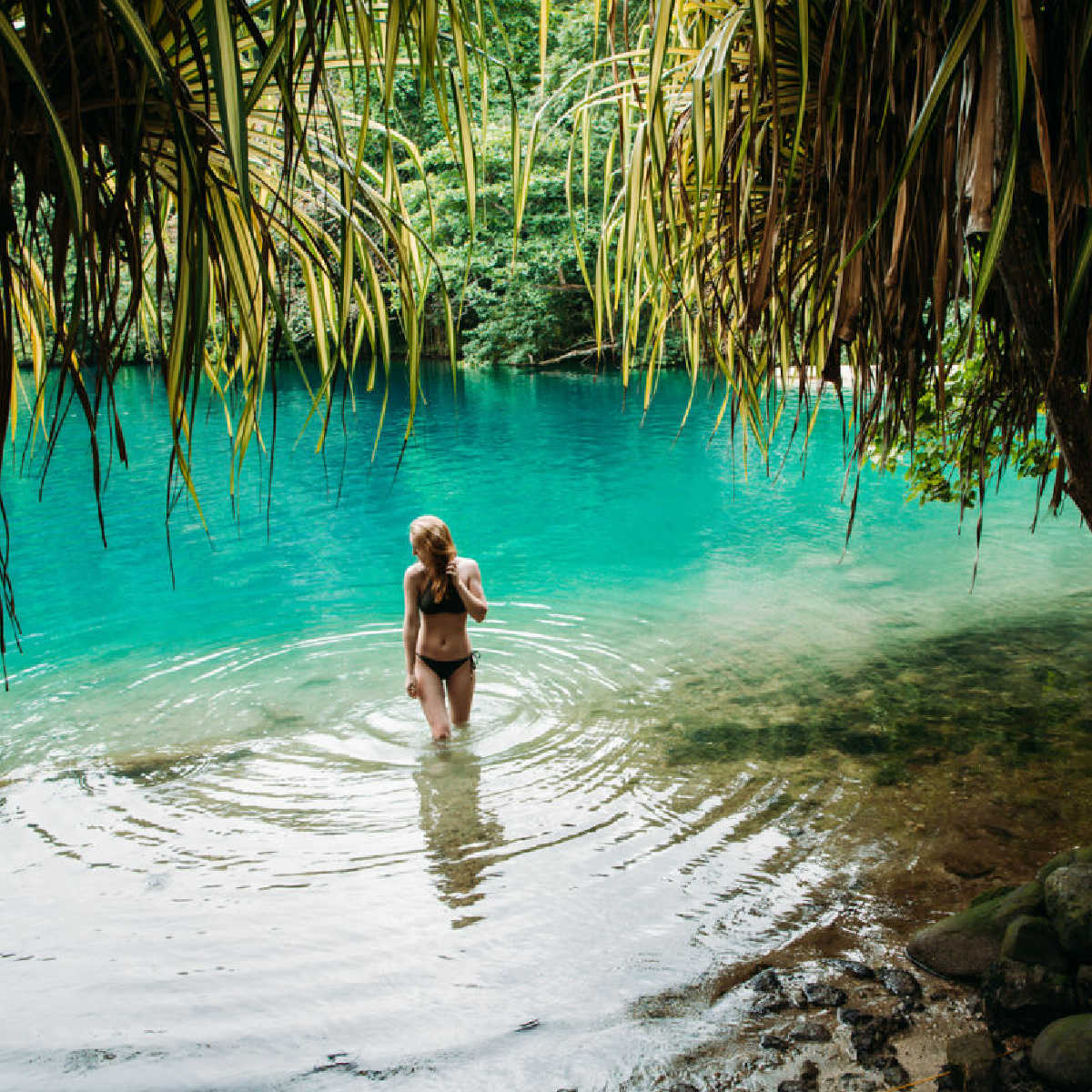 Female tourist in the Blue Lagoon, Jamaica