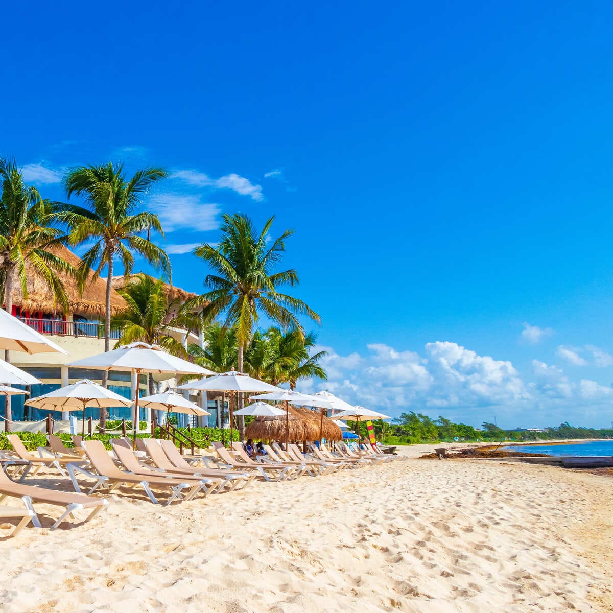 Loungers On A Sandy Beach In Mexico