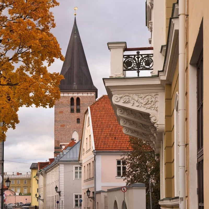 View Of A Church Tower From Ulikooli Street In Old Town Tartu, Estonia, Baltic States Of Eastern Europe