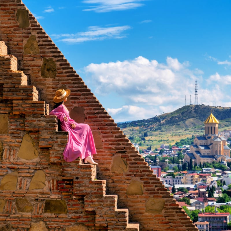 Woman on fortress looking out over Tbilisi, Georgia