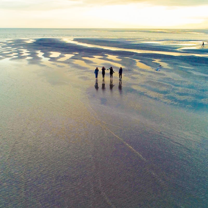 Beachgoers walking on Tybee Island