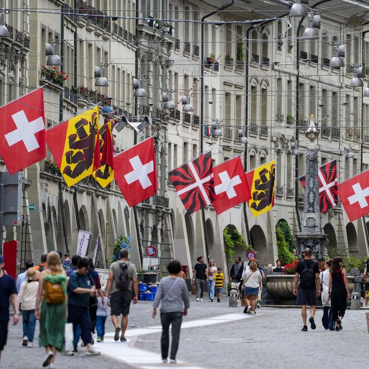 A Street Lined With Swiss Flags In Bern, Switzerland