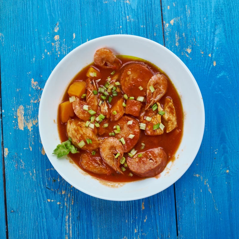 Bowl of gumbo on blue wooden table