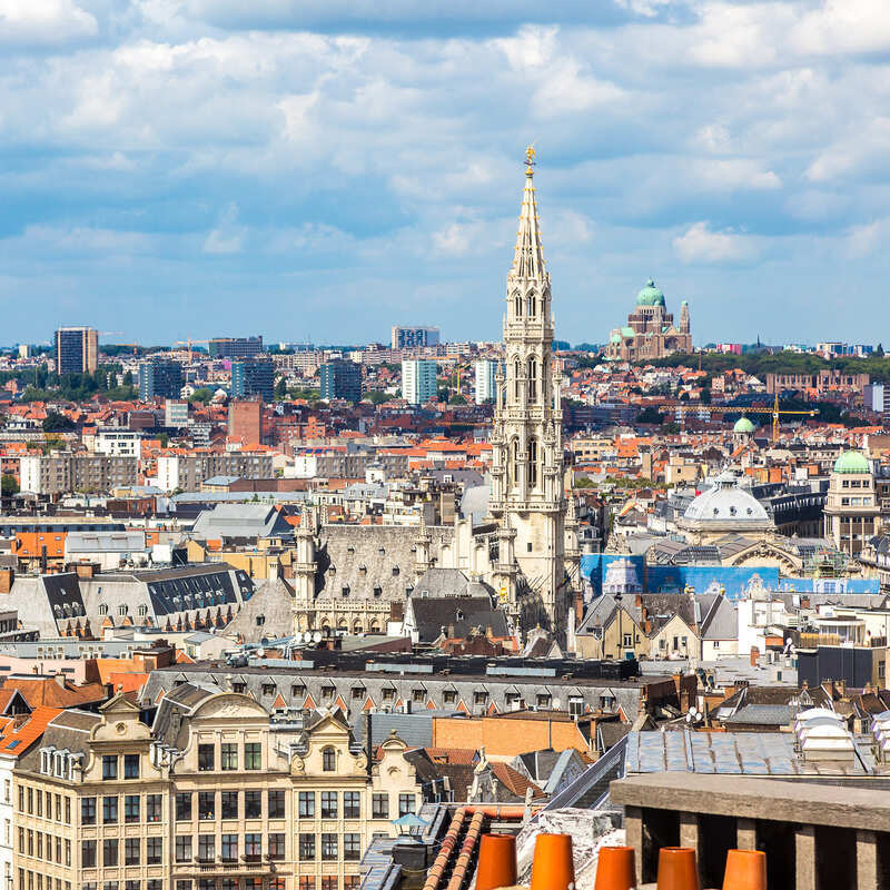 Cityscape Of Brussels, Capital City Of Belgium, With The Landmark Tower Of Grand Place Rising High Above The Old Town