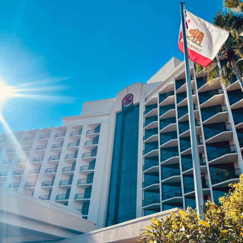 Exterior of Sheraton Hotel & Marina and California flag