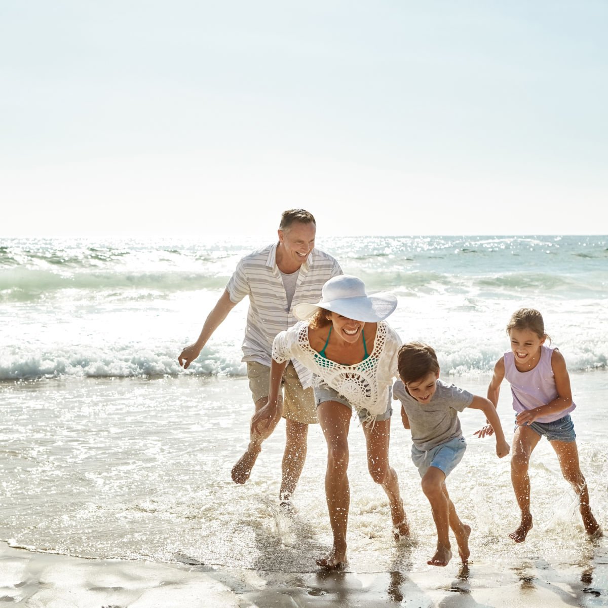 Happy family enjoying beach vacation