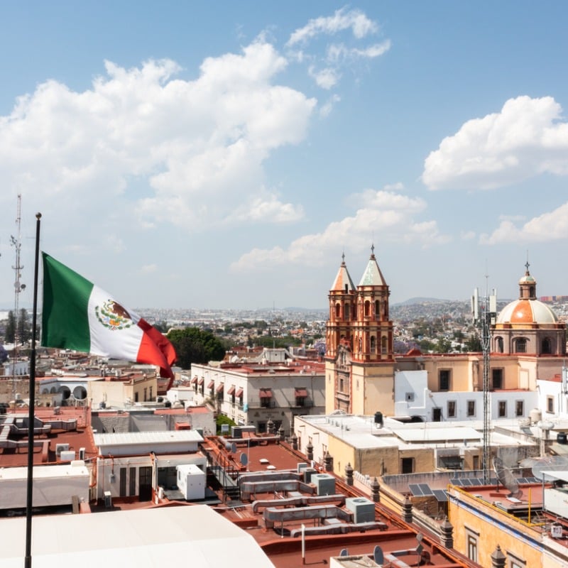 High Angle View Of Queretaro City In Mexico With Mexican Flag Flying