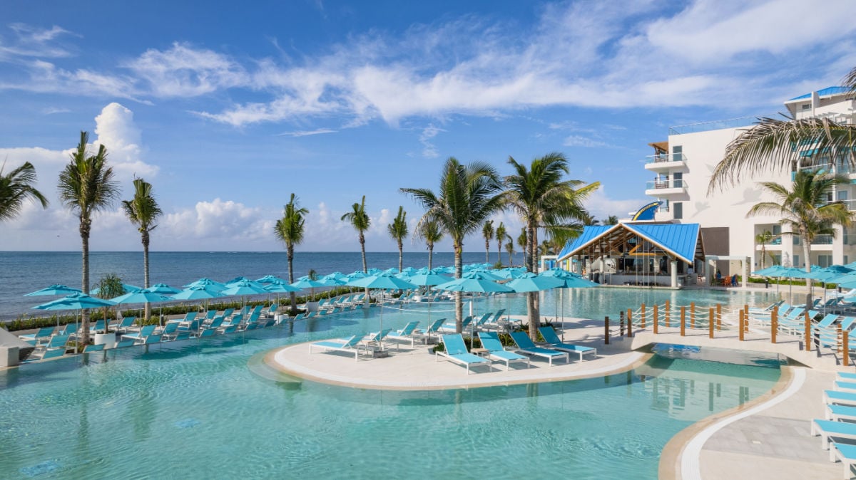 Pool with Landshark Brewery in the background at Margaritaville Riviera Maya