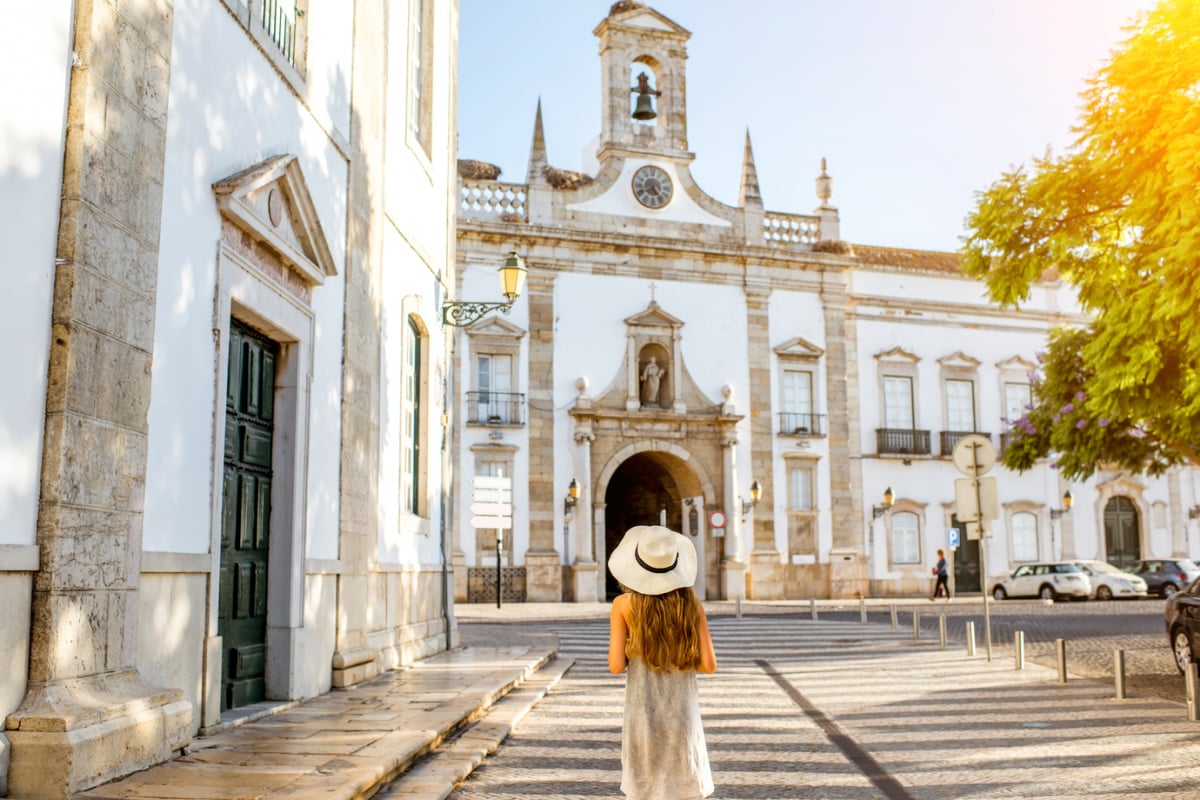 Woman exploring Faro's historic streets