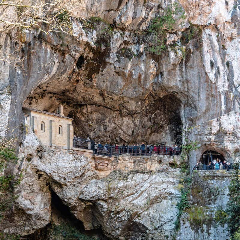 Chapel Built Into A Cave In The Sanctuary Of Covadonga In Picos De Europa, Asturias, Spain