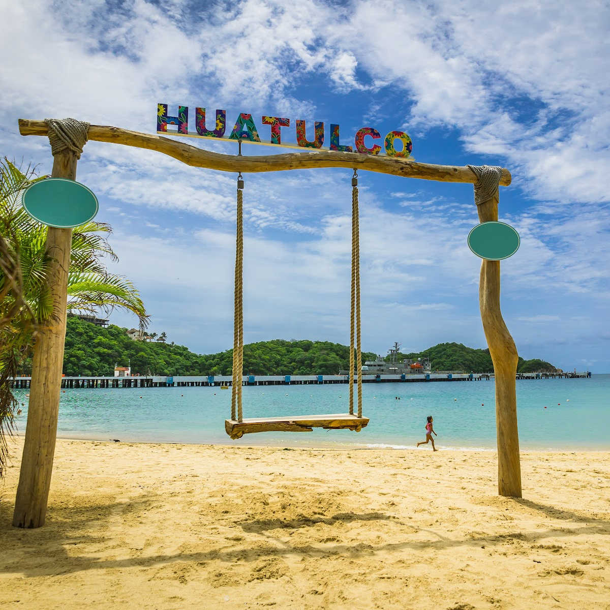 Huatulco banner on scenic beach