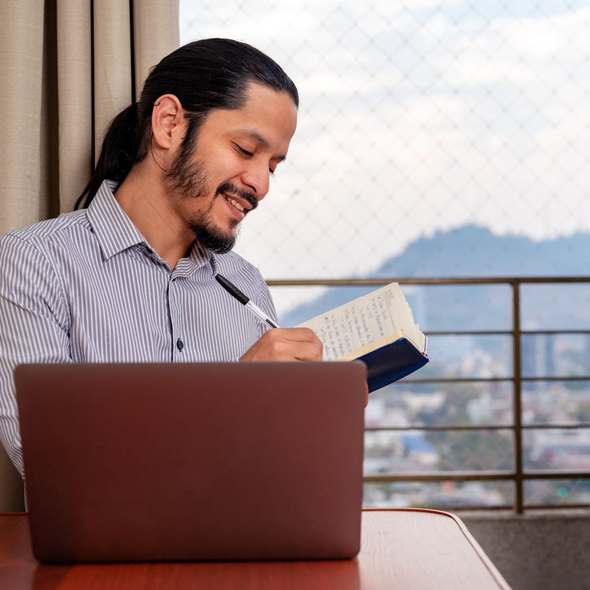 Remote worker using laptop at home in Santiago, Chile