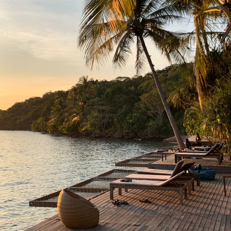 Resort lounge chairs overlooking bay of Koh Kood