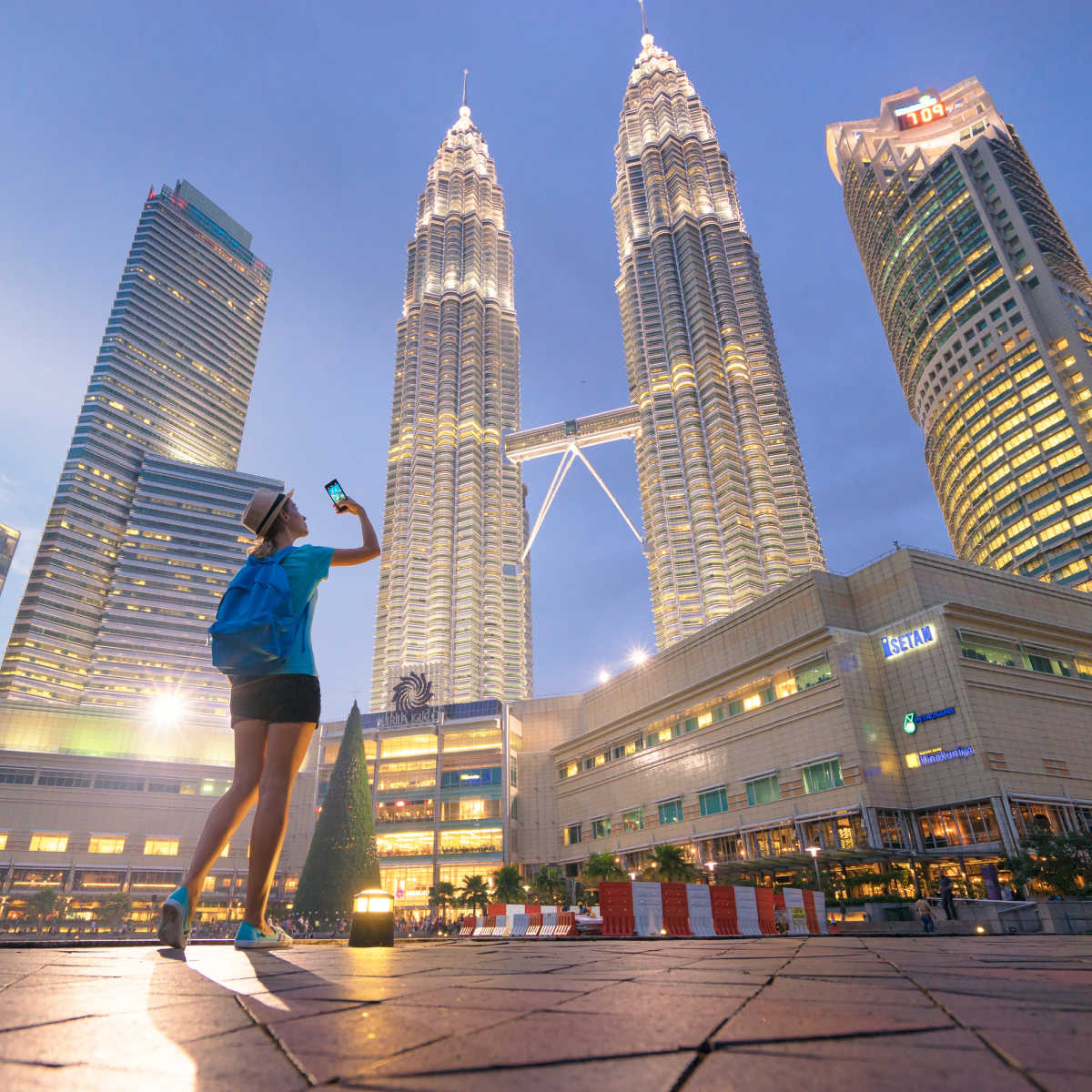 Tourist taking photo in Kuala Lumpur cityscape