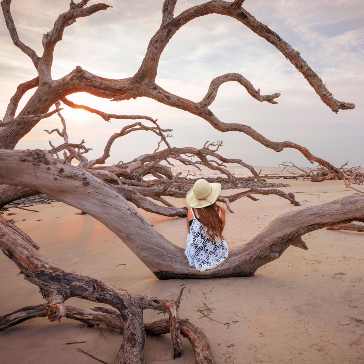 Woman visiting Driftwood Beach in Georgia