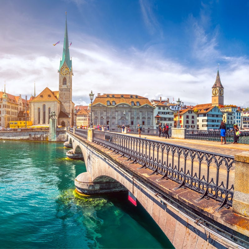 view of the city skyline in zurich switzerland with fraumunster church