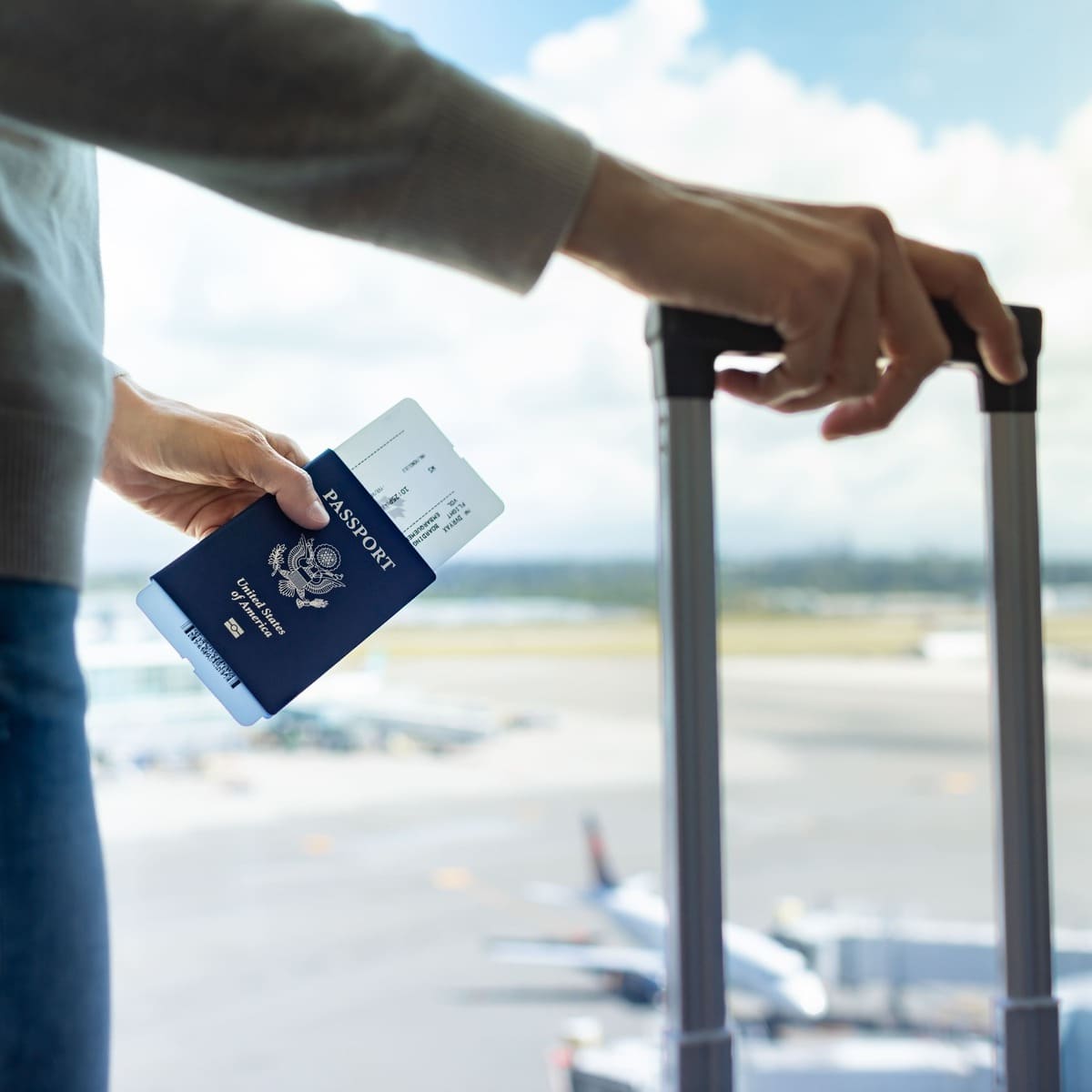 A Young Womna At The Airport Ready To Board A Flight With Her U.S. Passport