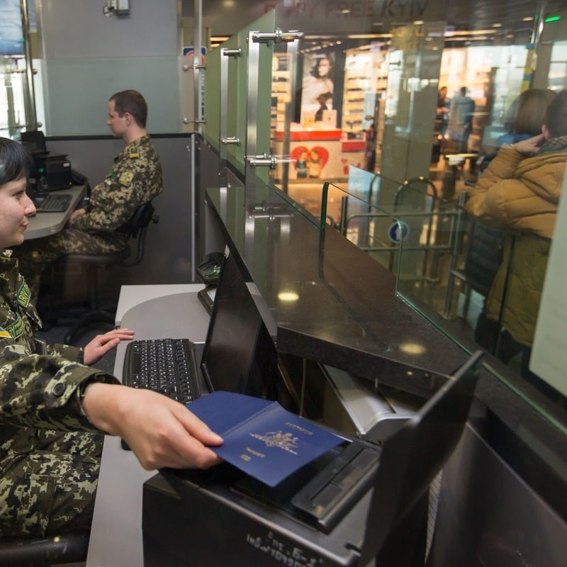 Border Officer Scanning What Appears To Be An Australian Passport During Border Check, International Travel