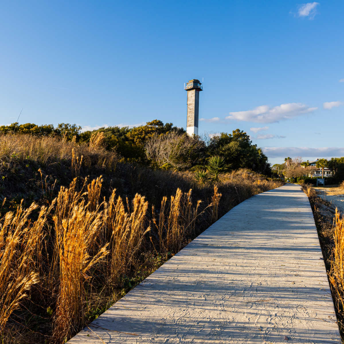 Lighthouse at sand dunes of Station 18 Beach in Sullivan's Island