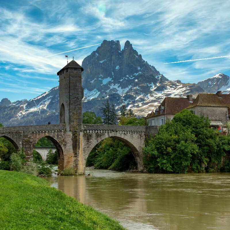 Quaint City Of Pau In Southwestern France, Backed By The Pyrenees Mountains