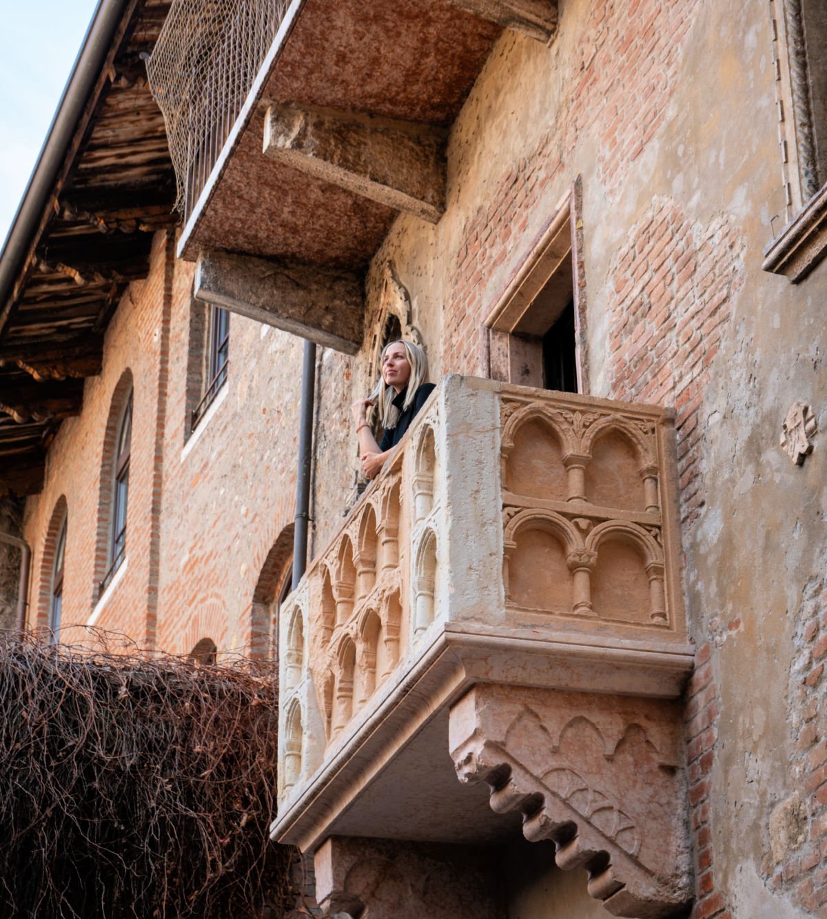 Woman on Juliet's balcony in Verona, Italy